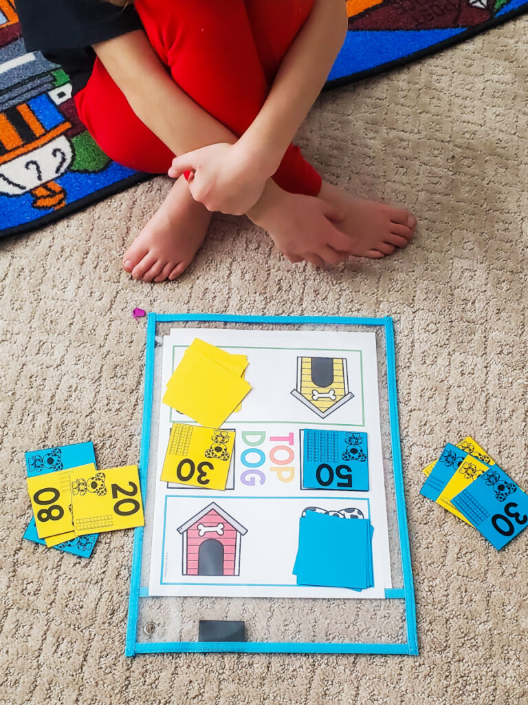 Math game mat with high and low number cards 