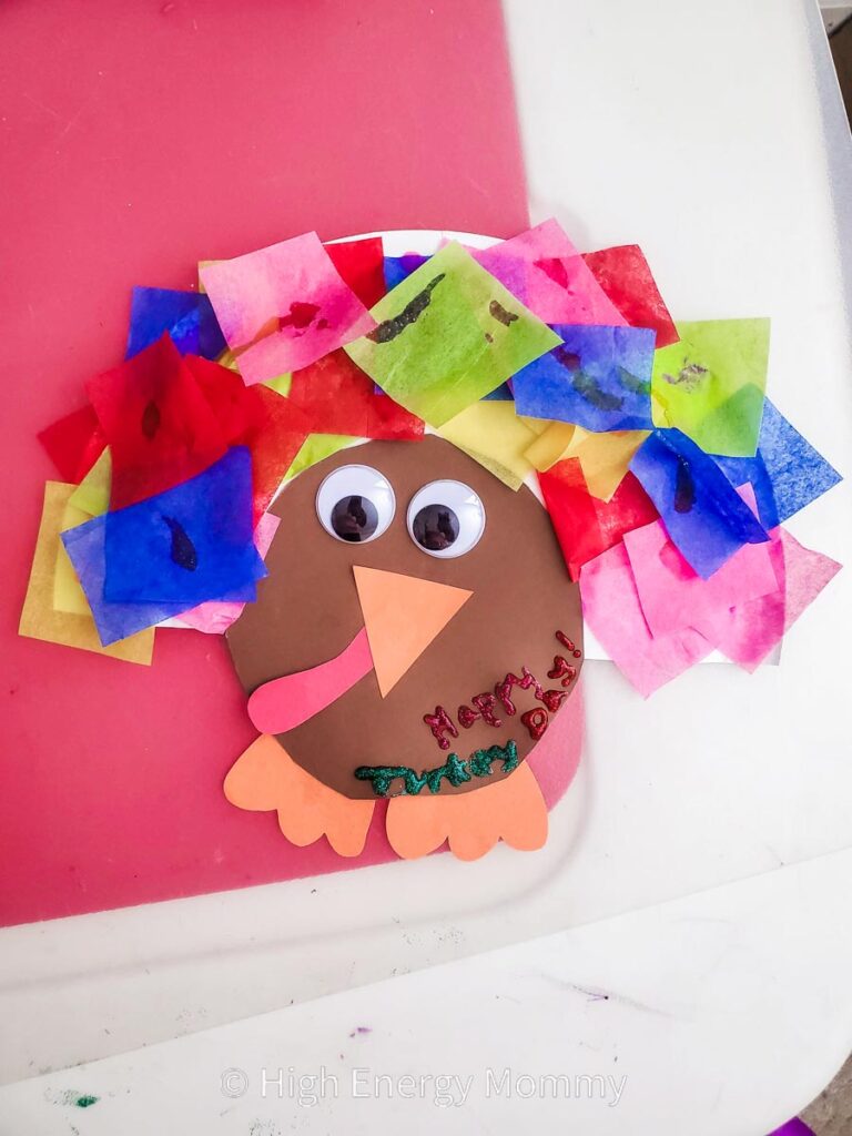 cute turkey crafts for kids turkey made with half of a paper plate and small colored tissue paper squares for it's feathers, and a construction paper face and feet