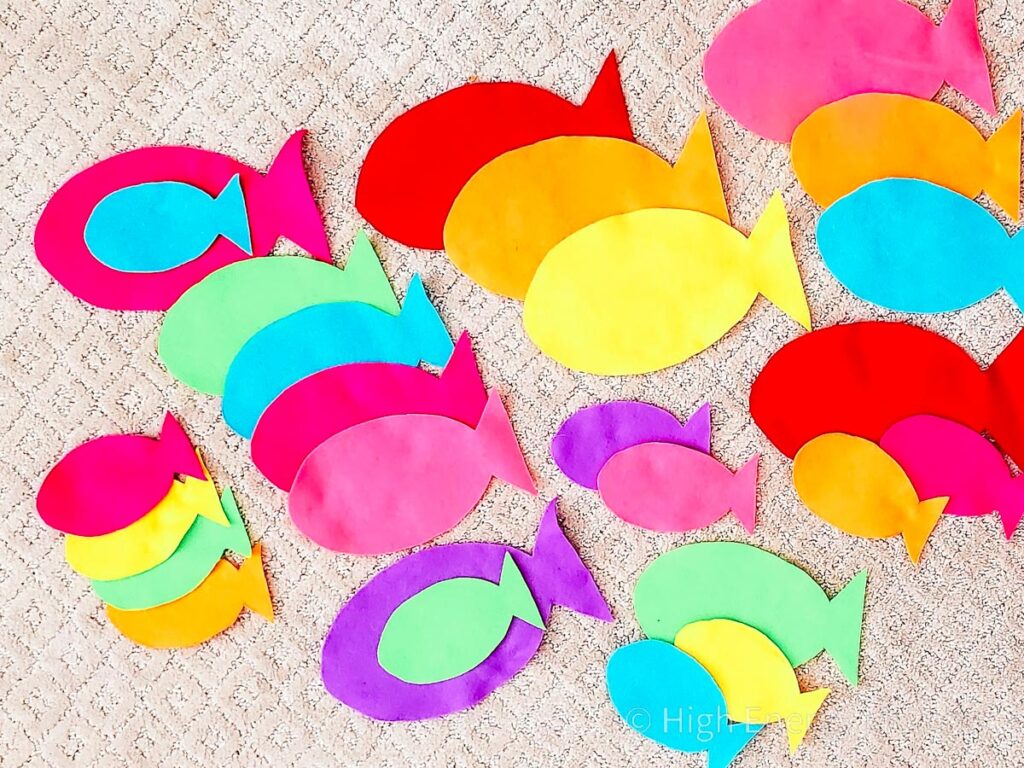 colorful felt cut into different size fish shapes for feed the shark game