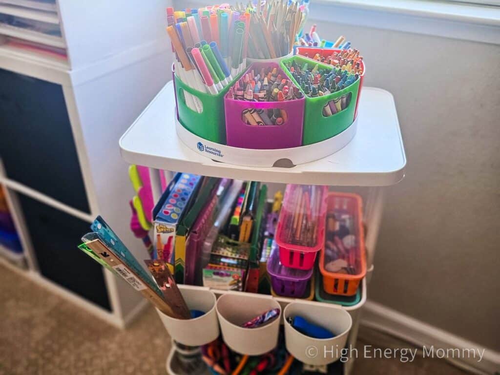white 3 tier card full of school supplies